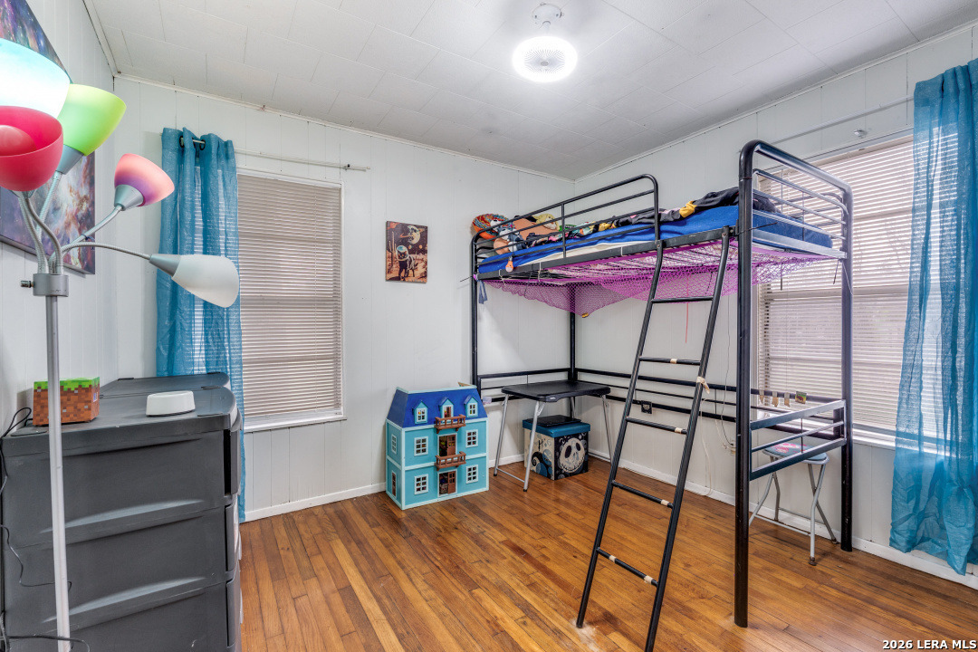 914 6th Street Blanco, TX 78606 - Photo 17 of 26 a bedroom with bunk bed and a window