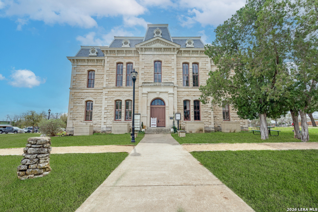 914 6th Street Blanco, TX 78606 - Photo 26 of 26 a front view of a house with garden