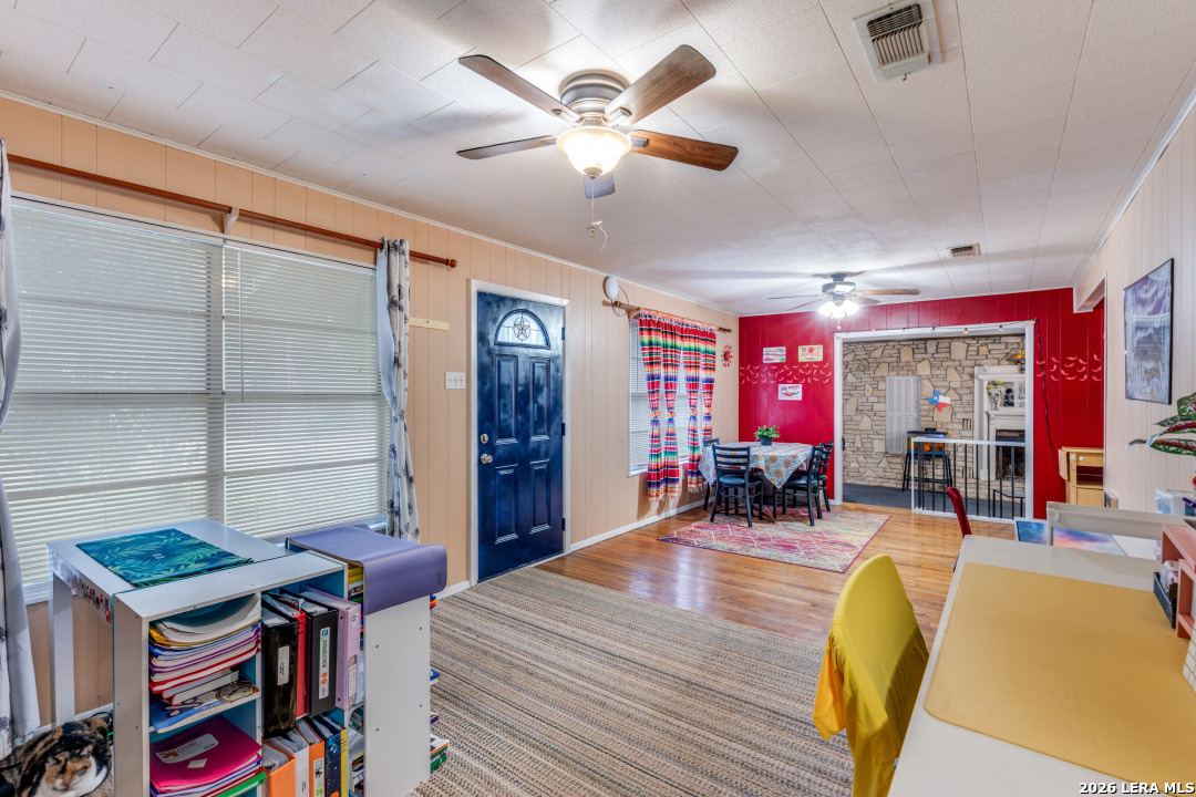 914 6th Street Blanco, TX 78606 - Photo 5 of 26 a living room with furniture and a chandelier