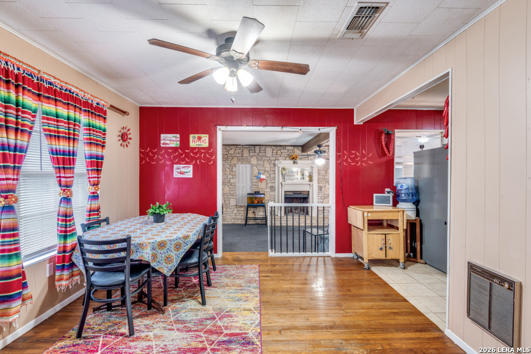 914 6th Street Blanco, TX 78606 - Photo 6 of 26 a dining room with wooden floor and chandelier