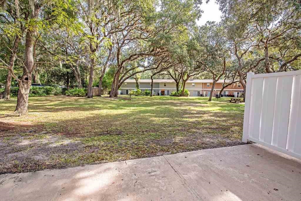 4420 Carter Road, Unit 44 St. Augustine, FL 32086 - Photo 13 of 18 a big yard with trees