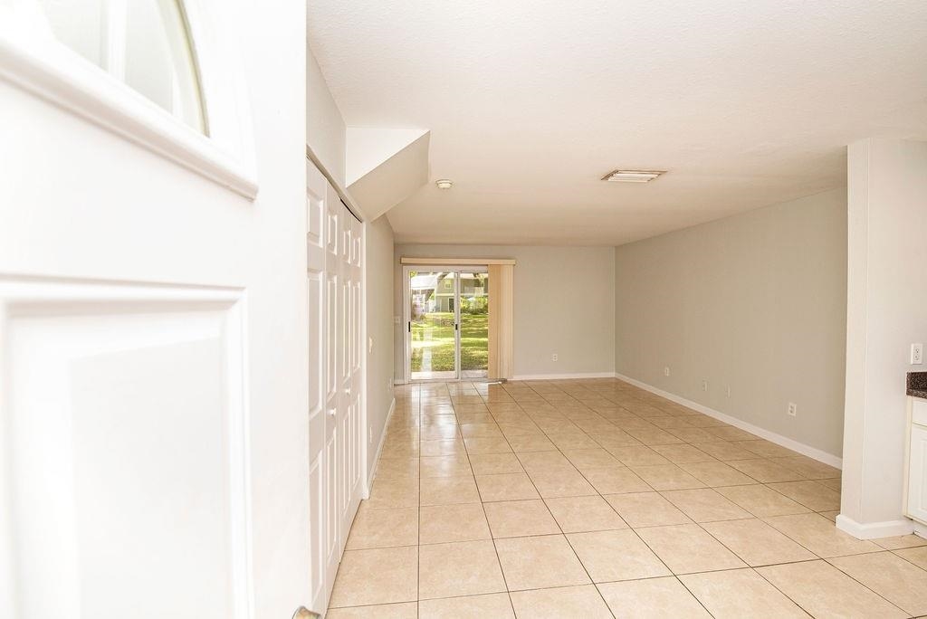 4420 Carter Road, Unit 44 St. Augustine, FL 32086 - Photo 7 of 18 a view of an empty room with a window