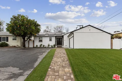a front view of a house with yard