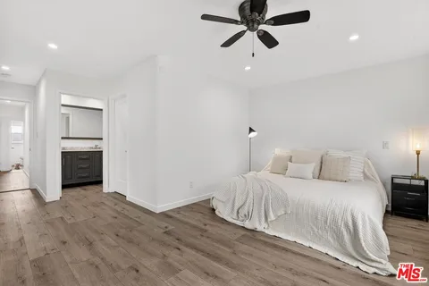 a bedroom with a bed and a fireplace