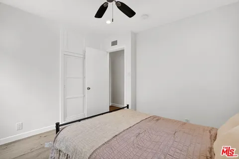 a bedroom with a bed and closet