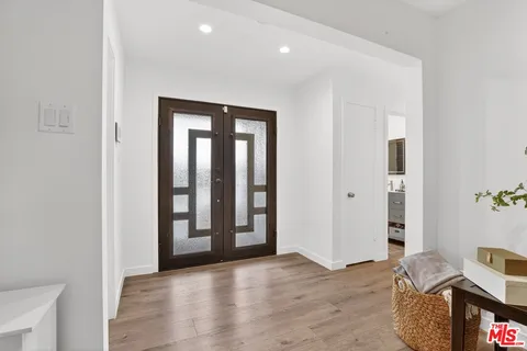 an entryway at livingroom with furniture and wooden floor