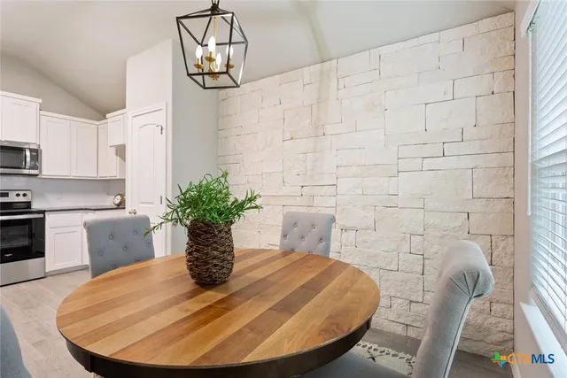 a view of a dining room with furniture