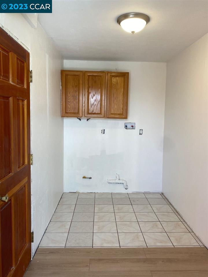 4882 San Pablo Dam Road, Unit B El Sobrante, CA 94803 - Photo 11 of 12 an empty room with wooden floor and windows