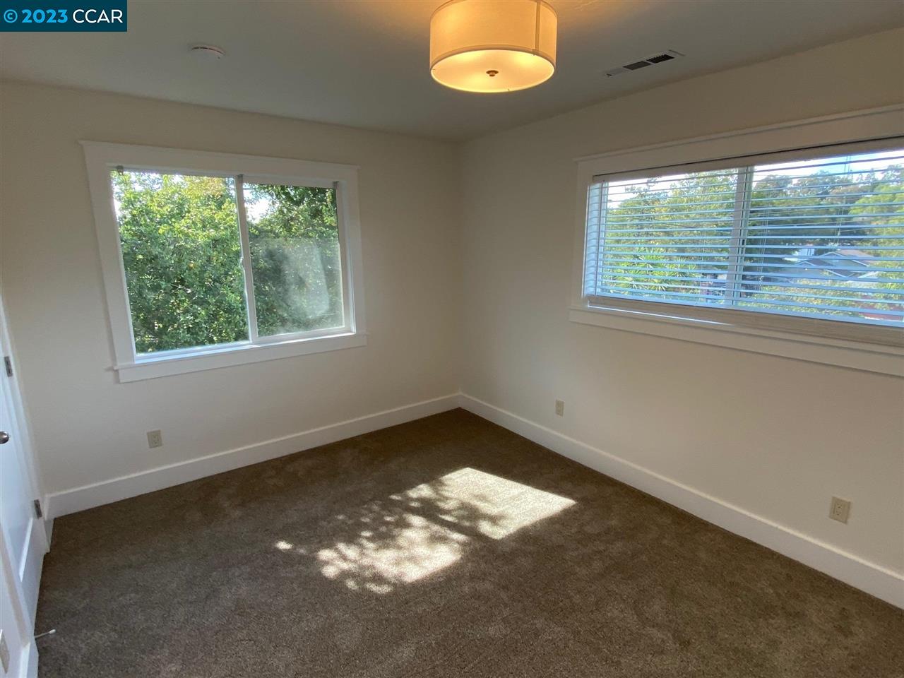 4882 San Pablo Dam Road, Unit B El Sobrante, CA 94803 - Photo 8 of 12 an empty room with a window