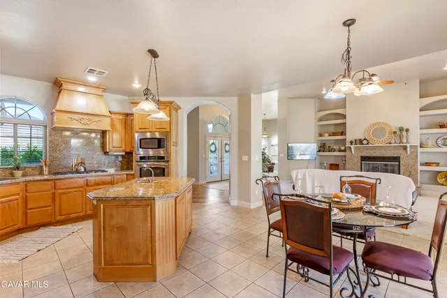 a kitchen with a sink cabinets and window