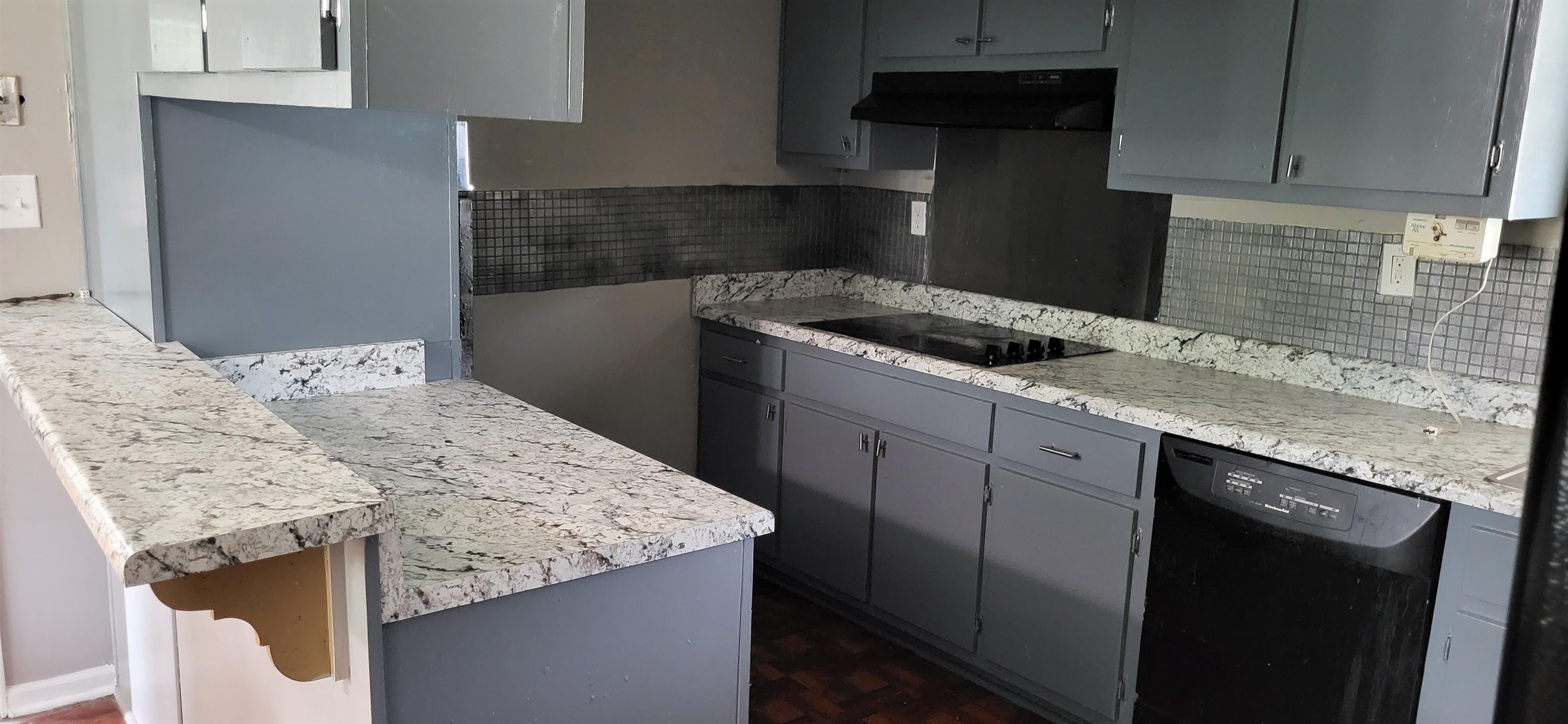 4567 Crump Road Memphis, TN 38141 - Photo 15 of 28 a kitchen with a granite countertop sink stove and cabinets