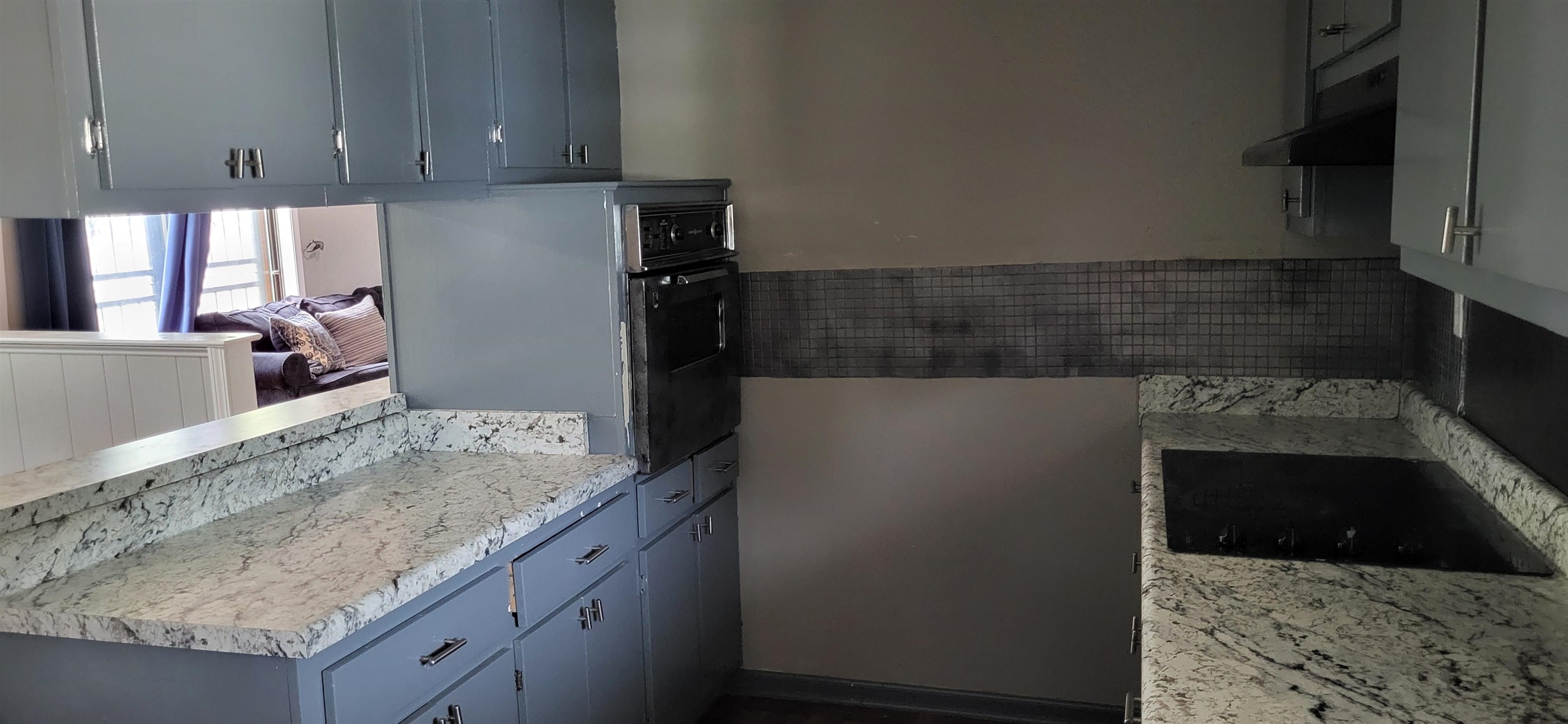 4567 Crump Road Memphis, TN 38141 - Photo 16 of 28 a kitchen with granite countertop a sink and a stove