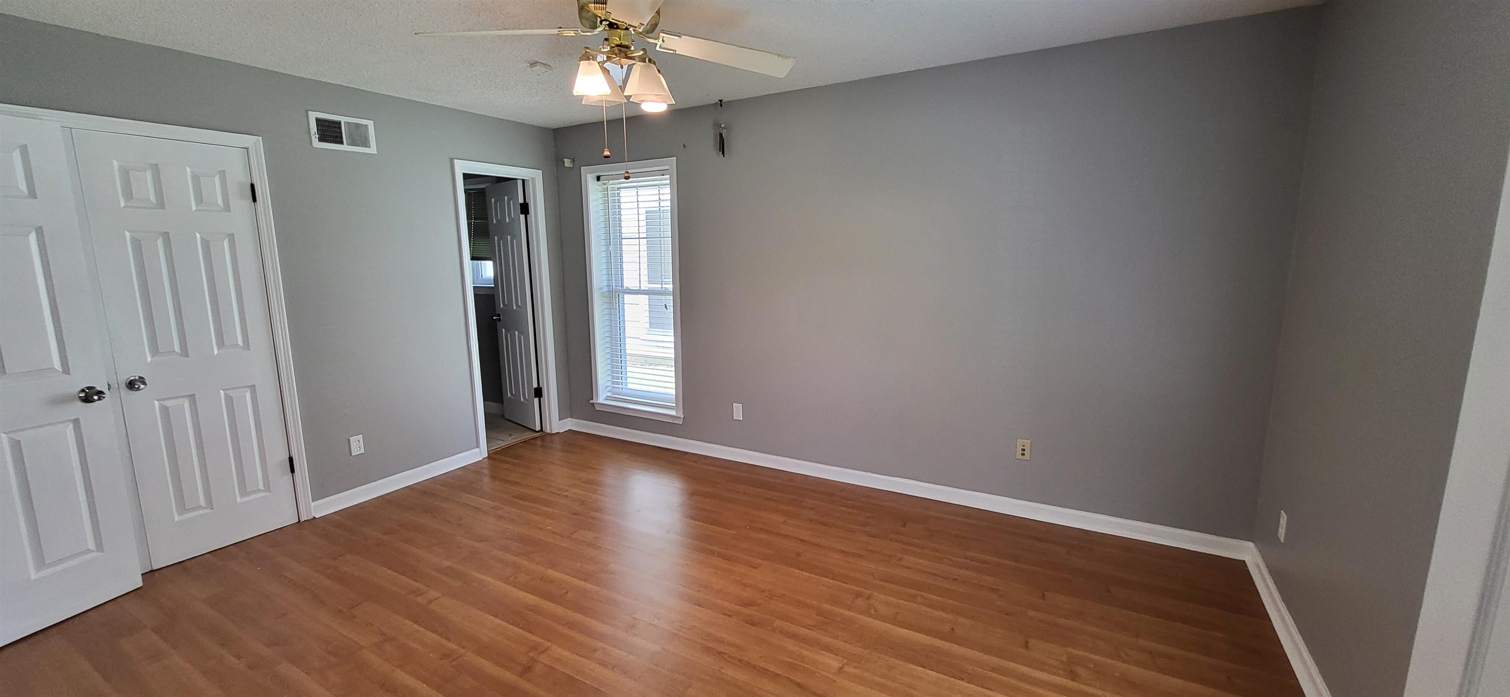4567 Crump Road Memphis, TN 38141 - Photo 18 of 28 a view of an empty room with wooden floor