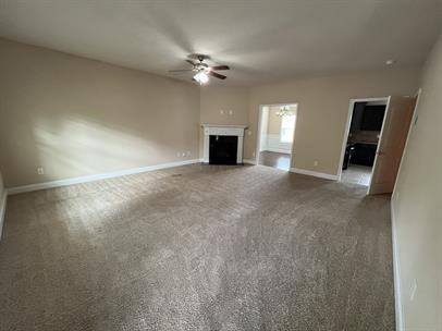 3829 Baxley Ridge Drive Suwanee, GA 30024 - Photo 2 of 11 a view of an empty room with a fireplace
