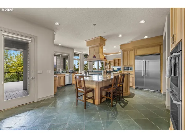 a dining room with furniture and a view of kitchen