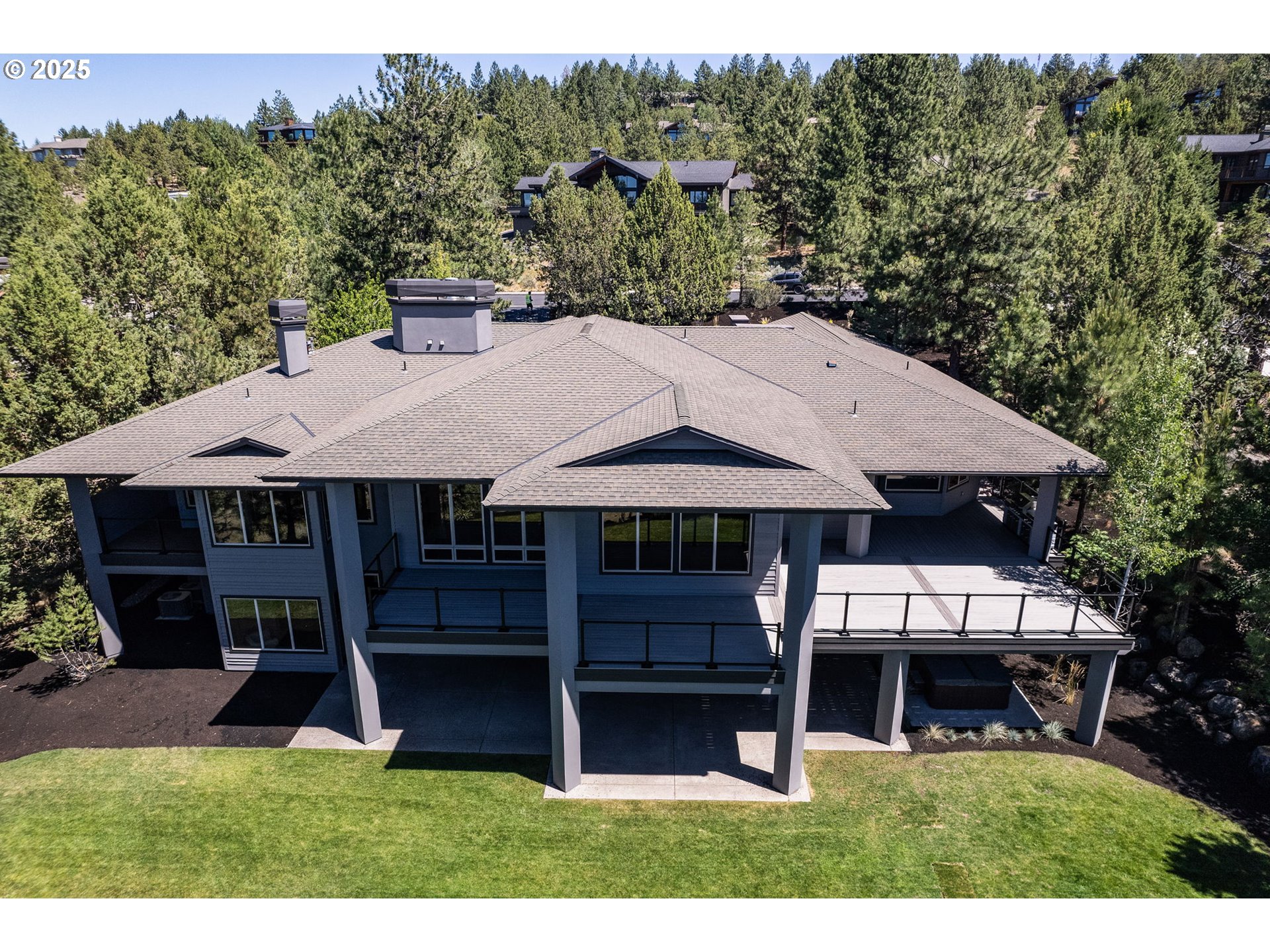 3155 Northwest Metke Place Bend, OR 97703 - Photo 2 of 28 an aerial view of a house with porch yard basket ball court and outdoor seating