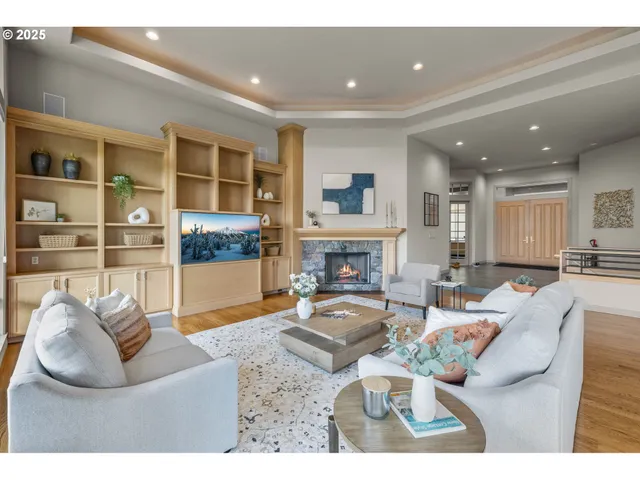 a living room with furniture and a fireplace