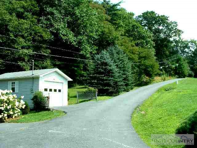 Lot Rabbit Rabbit Run Road Boone, NC 28607 - Photo 1 of 1 a front view of a house with garden