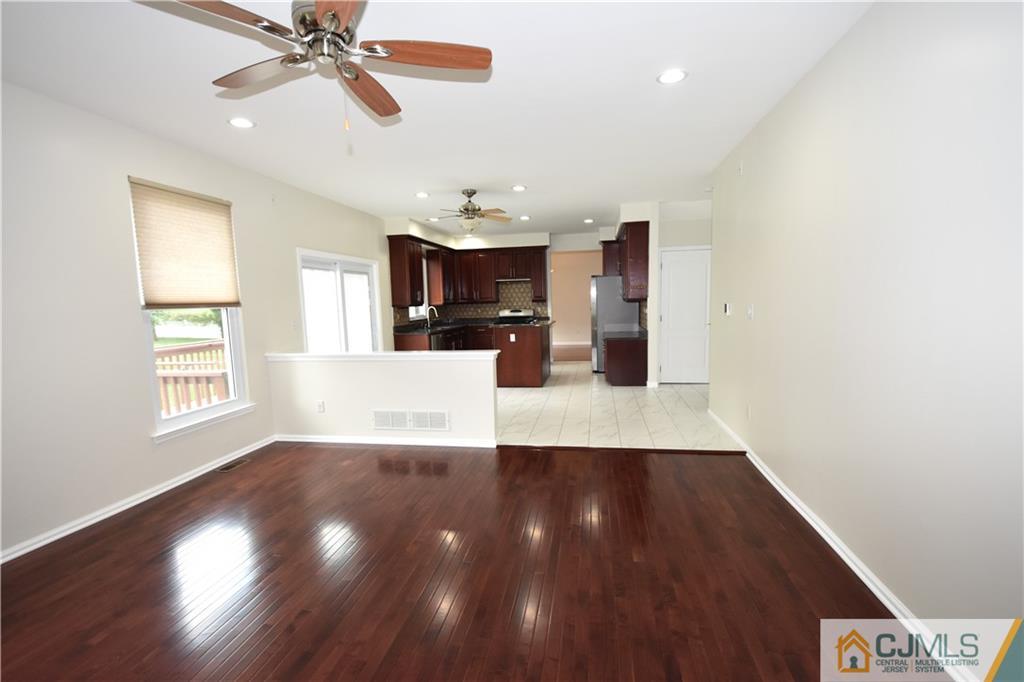 1 Timber Ridge Road North Brunswick, NJ 08902 - Photo 13 of 38 a view of a kitchen with wooden floor and staircase