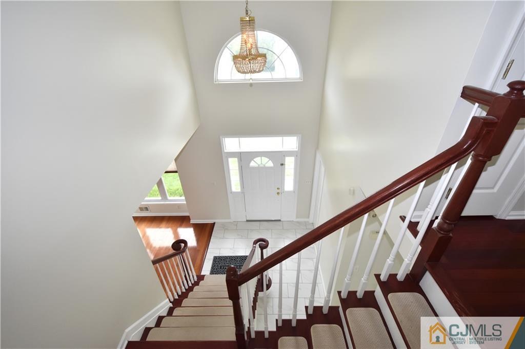 1 Timber Ridge Road North Brunswick, NJ 08902 - Photo 15 of 38 a view of entryway and hall with wooden floor