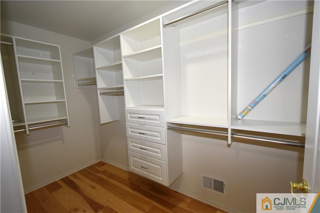 1 Timber Ridge Road North Brunswick, NJ 08902 - Photo 23 of 38 a view of walk in closet with empty racks