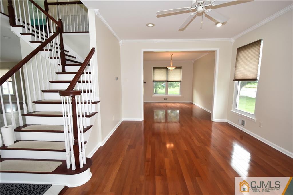 1 Timber Ridge Road North Brunswick, NJ 08902 - Photo 4 of 38 a view of an entryway with wooden floor and door