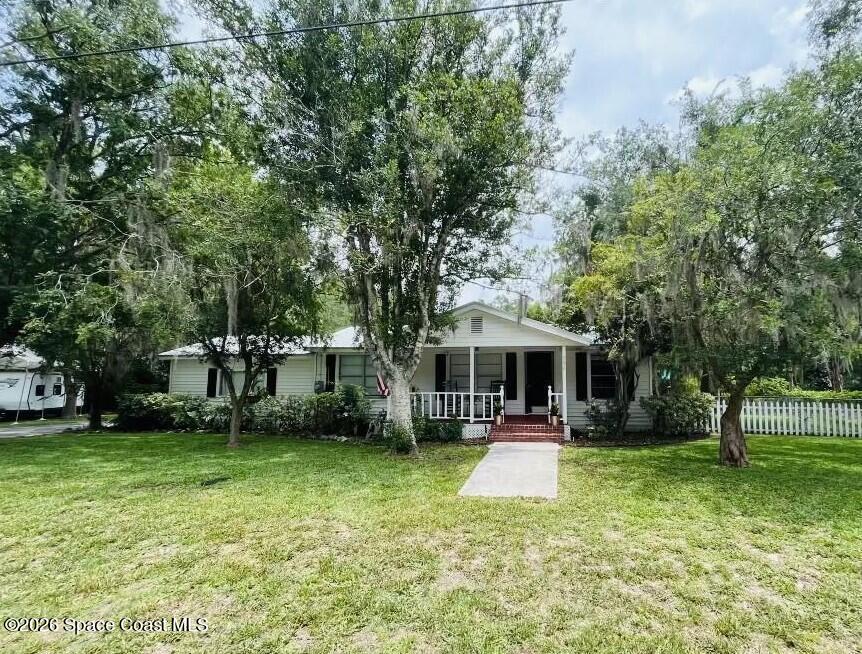 295 Southwest 252nd Street Newberry, FL 32669 - Photo 1 of 2 a view of a house with a backyard porch and sitting area