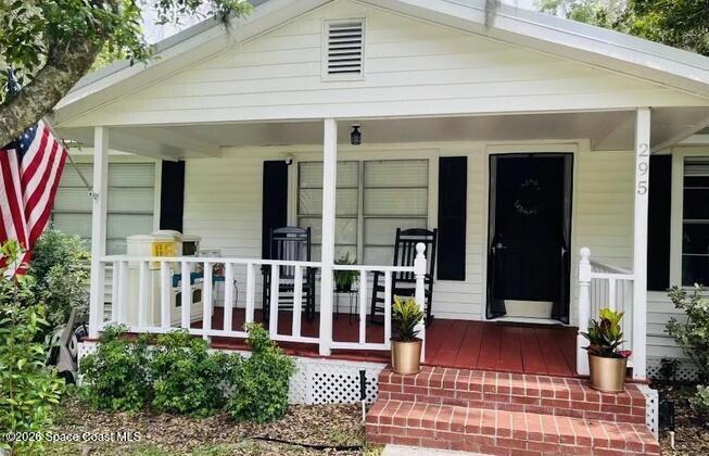 295 Southwest 252nd Street Newberry, FL 32669 - Photo 2 of 2 a view of a house with large windows and plants