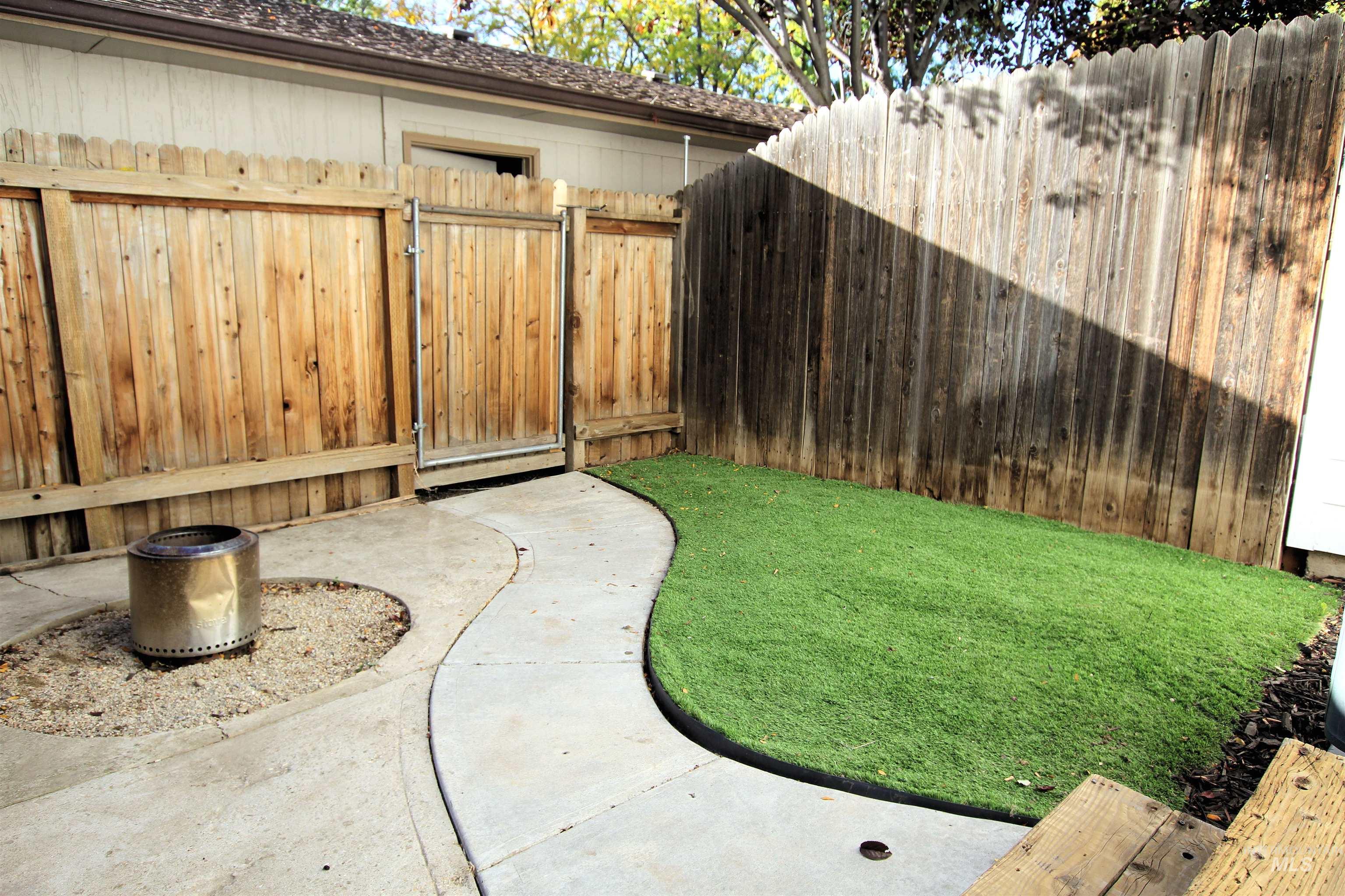 8405 West Rifleman Street Boise, ID 83704 - Photo 3 of 11 View of yard featuring a gate