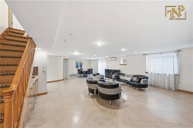 a living room with lots of furniture and a chandelier