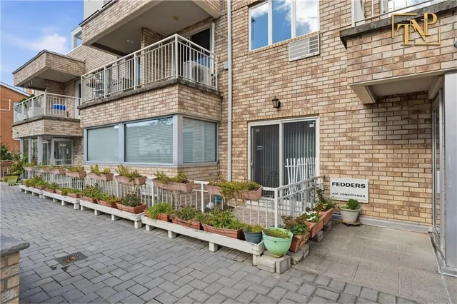 an outdoor view of a house with a large windows