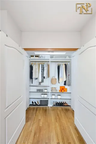 a view of living room with furniture and wooden floor