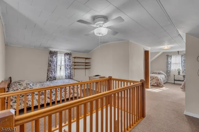 a bedroom with furniture and a chandelier