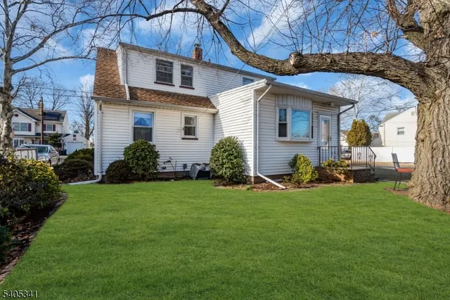 a view of a backyard with a tree