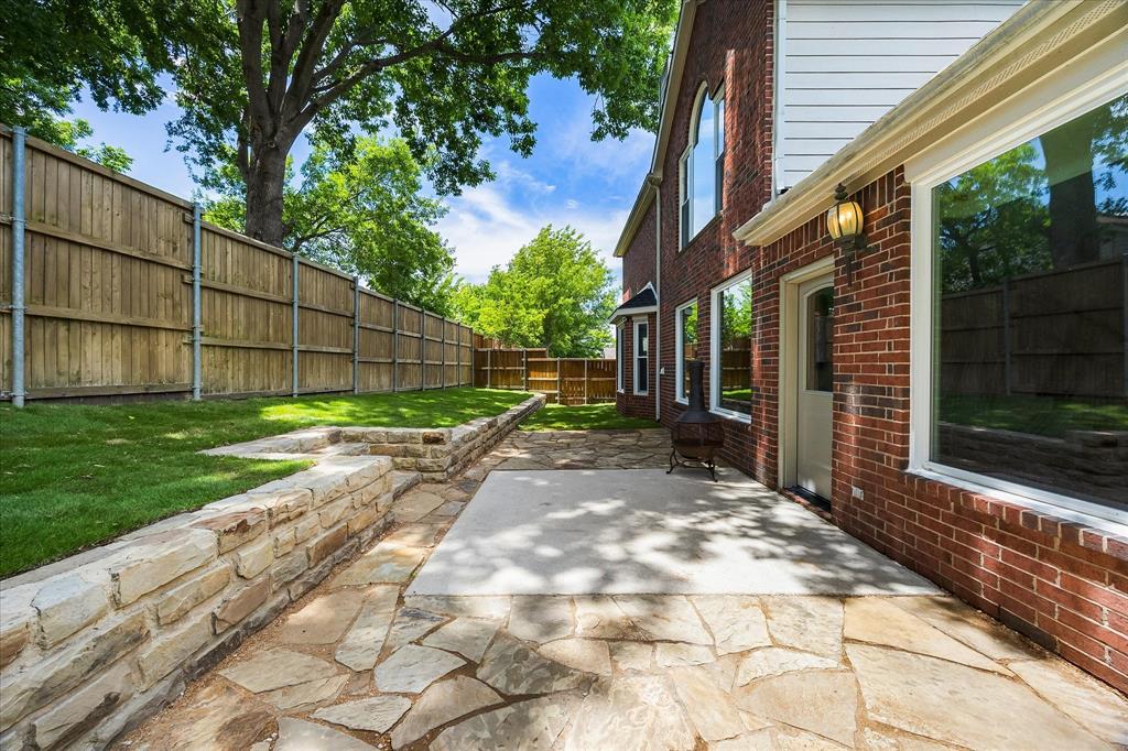 645 Channel Ridge Drive Rockwall, TX 75087 - Photo 31 of 40 The backyard has fresh sod and the flagstone patio has been extended and refreshed.