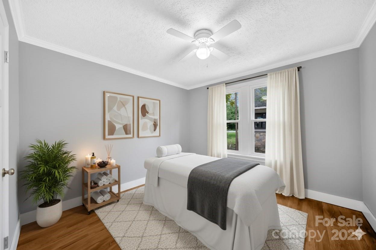 95 Whitmire Street Brevard, NC 28712 - Photo 12 of 34 a bedroom with a large bed and a window