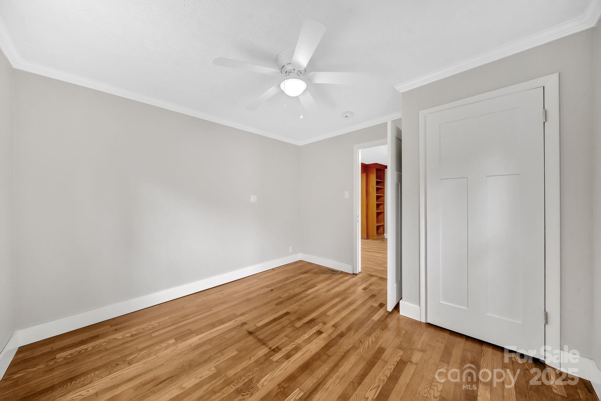 95 Whitmire Street Brevard, NC 28712 - Photo 18 of 34 an empty room with wooden floor and closet