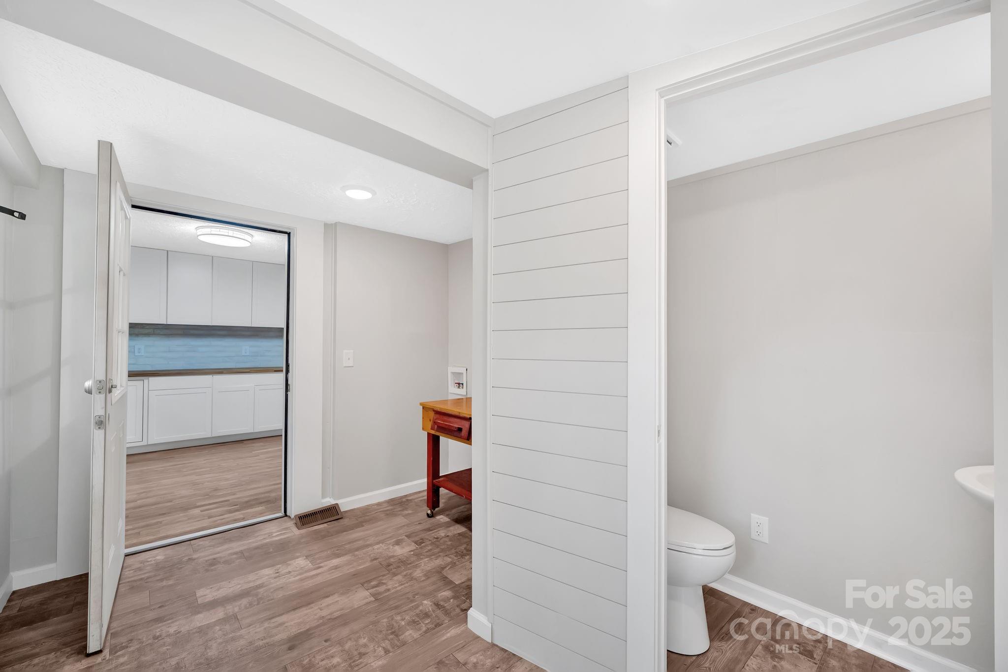 95 Whitmire Street Brevard, NC 28712 - Photo 25 of 34 a bathroom with a toilet and a shower