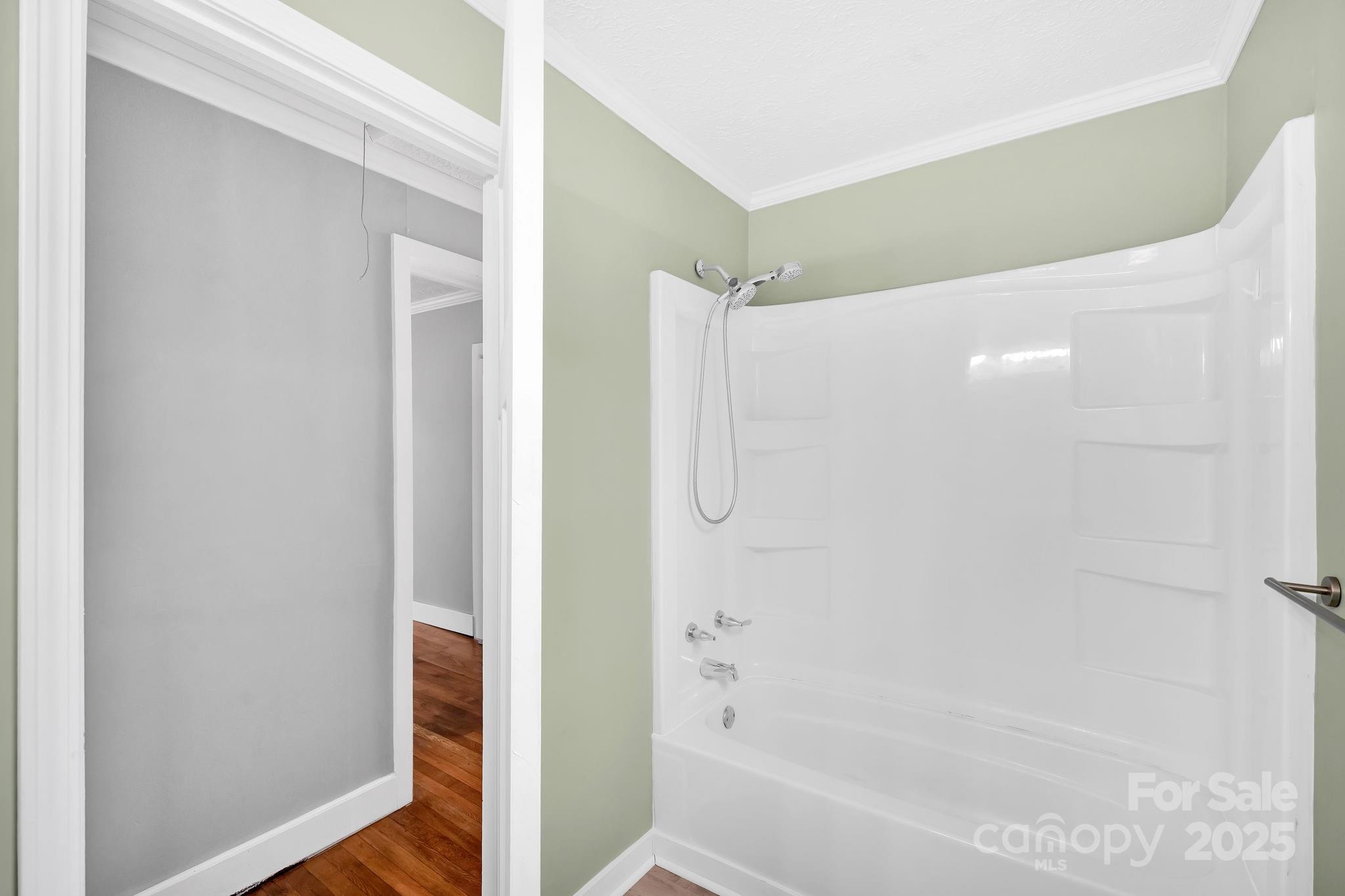 95 Whitmire Street Brevard, NC 28712 - Photo 9 of 34 a bathroom with a bathtub and shower