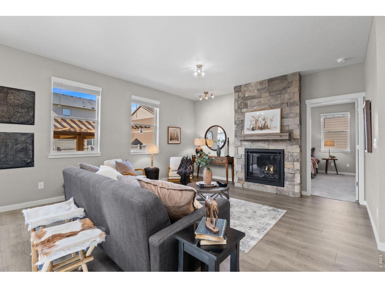 1577 Sun River Road Berthoud, CO 80513 - Photo 7 of 24 a living room with furniture a fireplace and a window