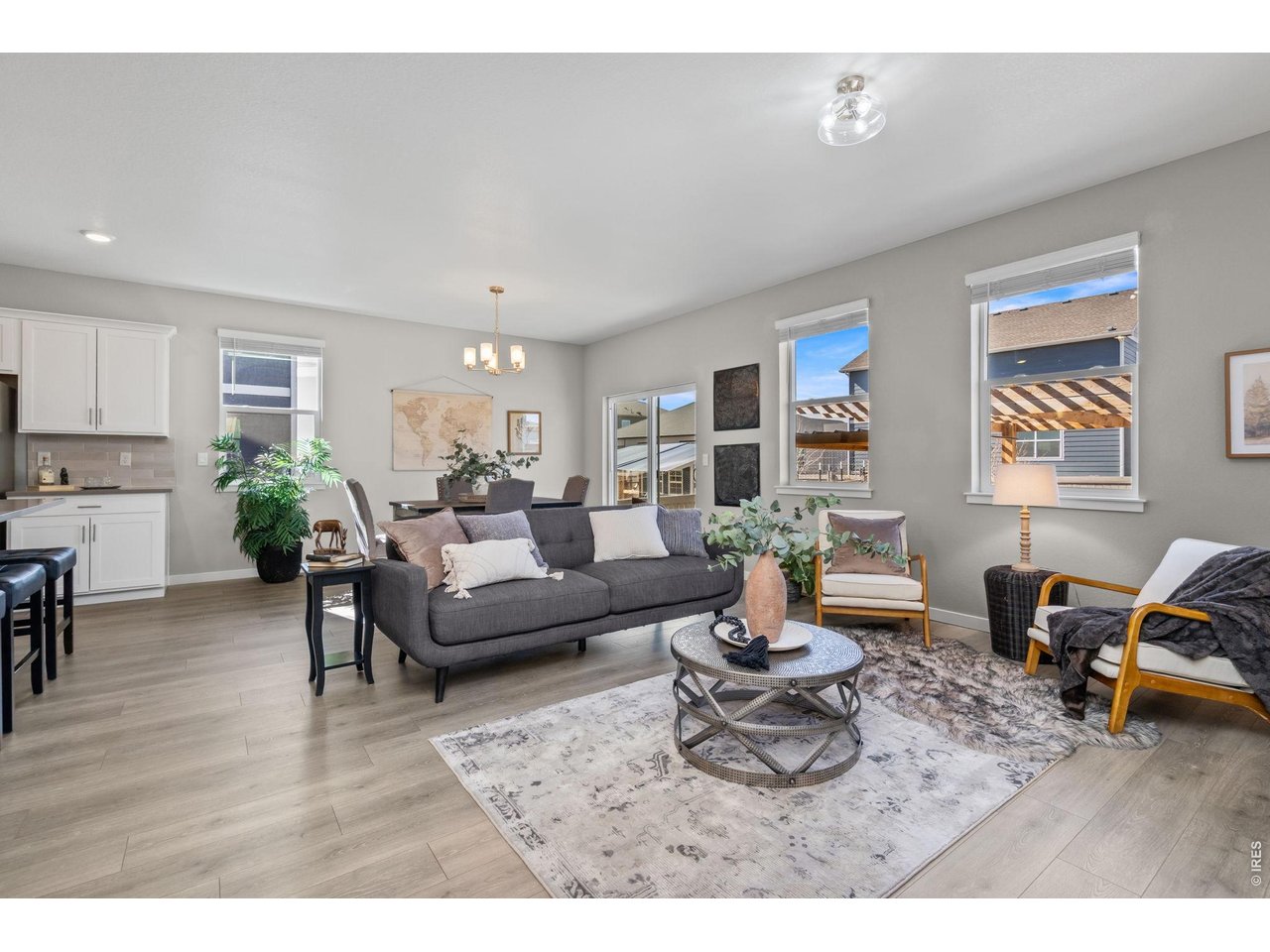 1577 Sun River Road Berthoud, CO 80513 - Photo 9 of 24 a living room with furniture and a wooden floor