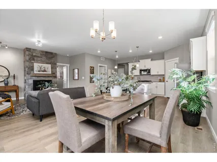 a dining room with furniture and window