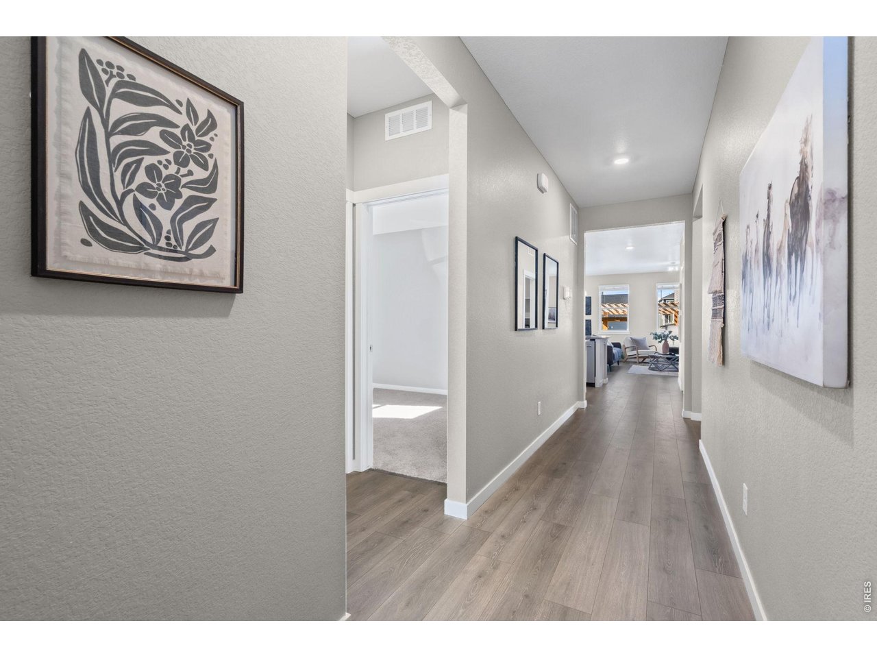 1577 Sun River Road Berthoud, CO 80513 - Photo 10 of 24 a view of a hallway with wooden floor