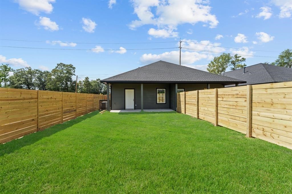 7311 Sandra Street, Unit B Houston, TX 77028 - Photo 5 of 8 a view of a backyard with garden