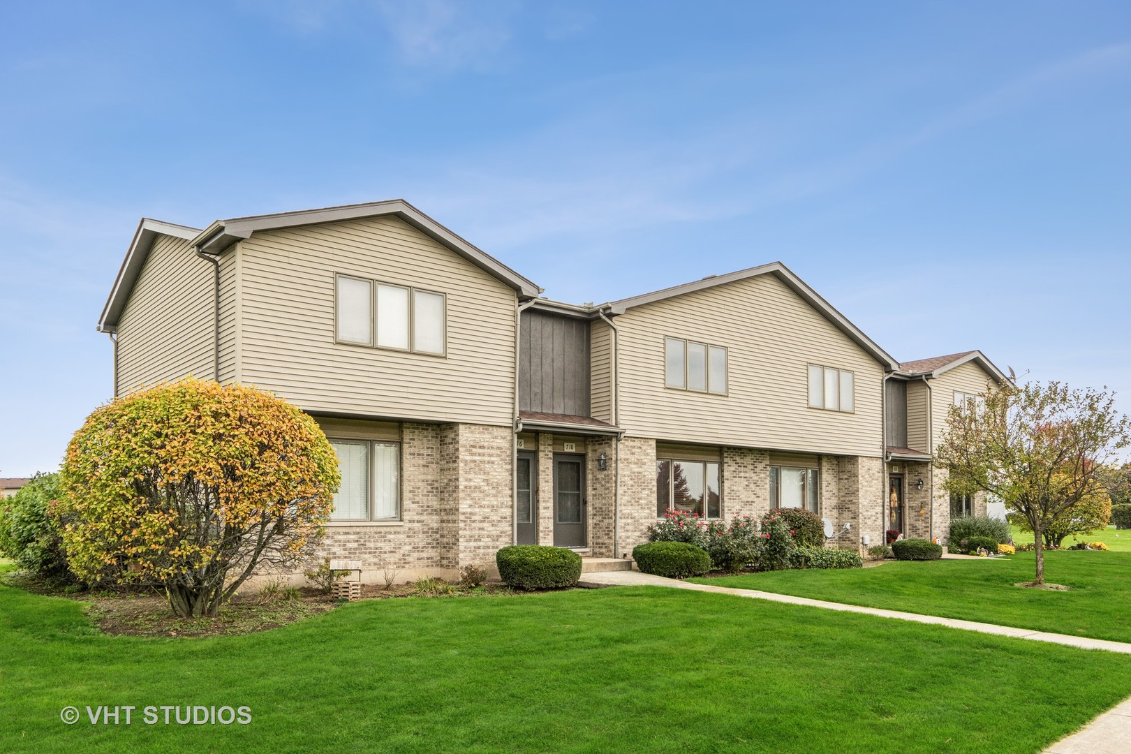 718 Sojourn Road New Lenox, IL 60451 - Photo 1 of 16 a front view of a house with a yard