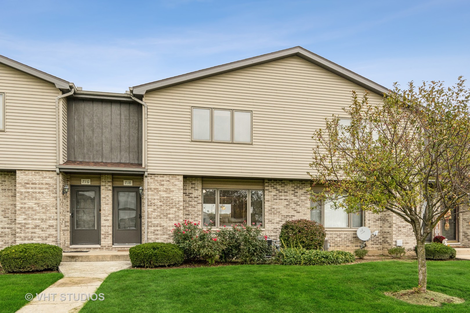 718 Sojourn Road New Lenox, IL 60451 - Photo 2 of 16 a front view of a house with a garden