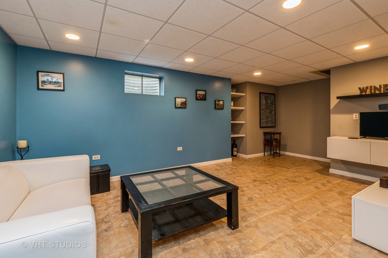 718 Sojourn Road New Lenox, IL 60451 - Photo 13 of 16 a living room with a couch and a table with wooden floor