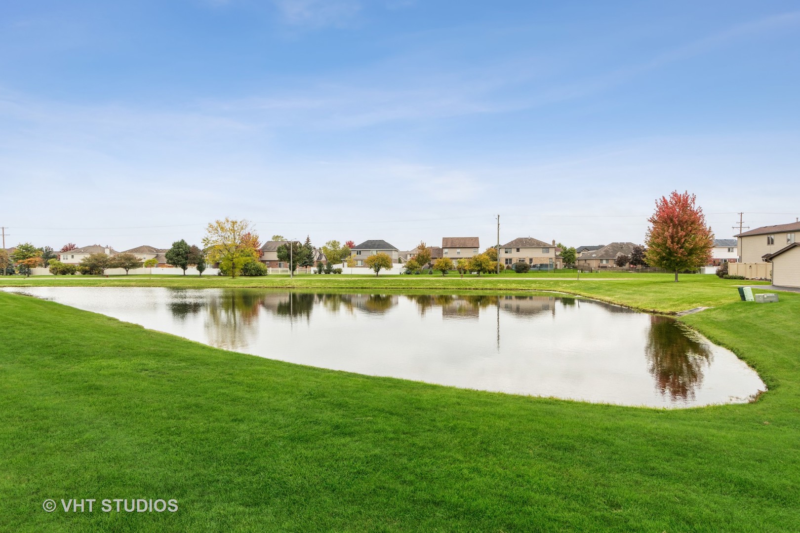 718 Sojourn Road New Lenox, IL 60451 - Photo 16 of 16 a view of a lake with houses in the back