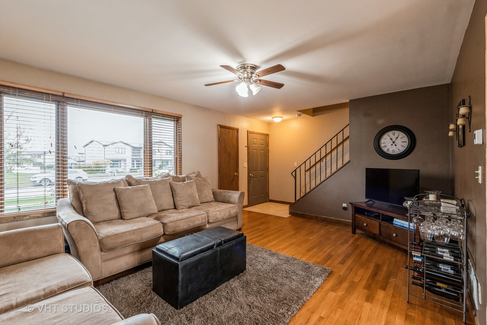 718 Sojourn Road New Lenox, IL 60451 - Photo 4 of 16 a living room with furniture and a flat screen tv