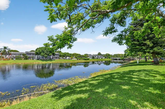 a view of a lake with houses in the back